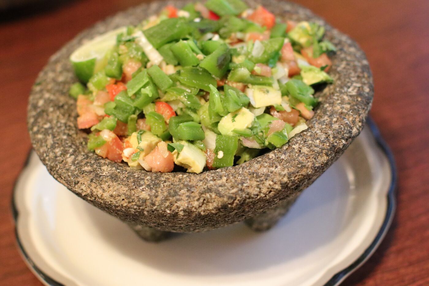 Chunky guacamole in a molcajete